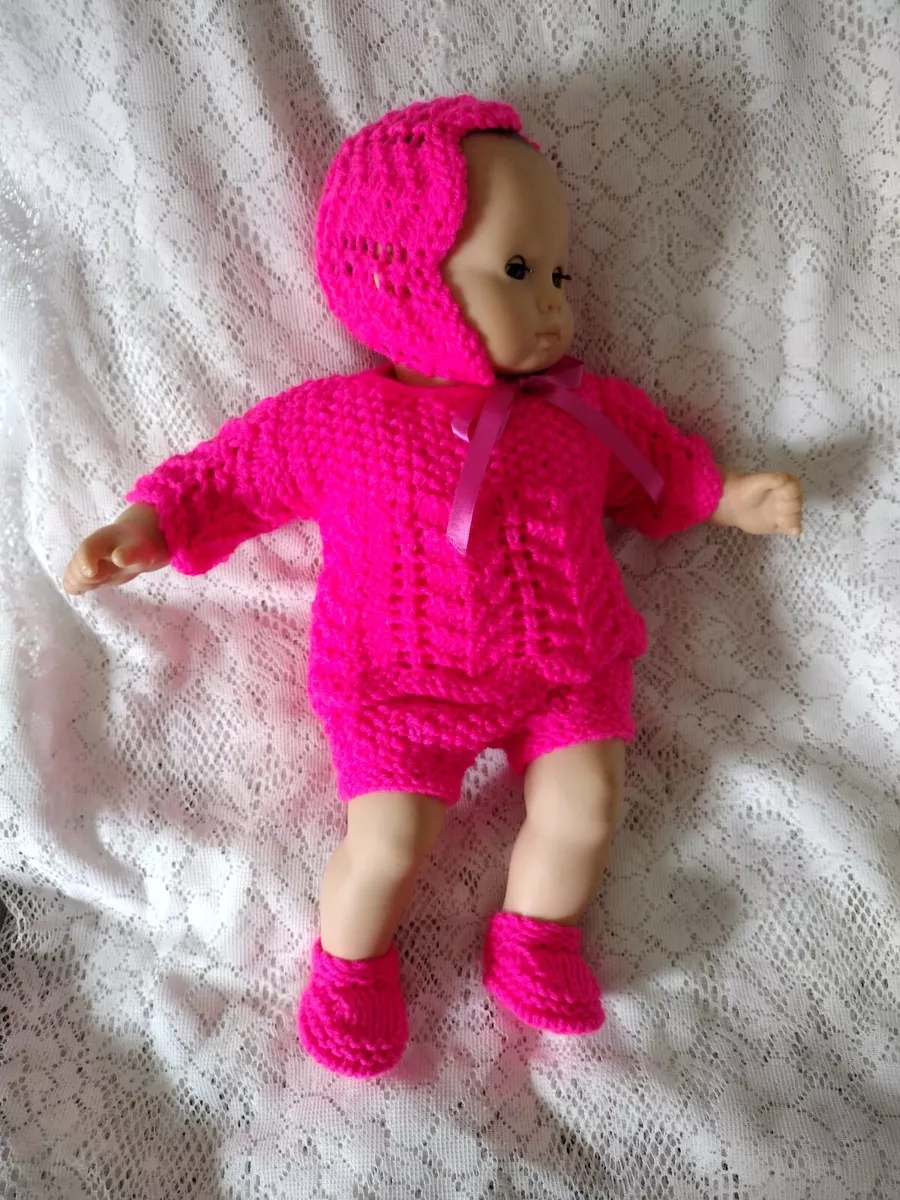 Hand knitted dolls on sale clothes