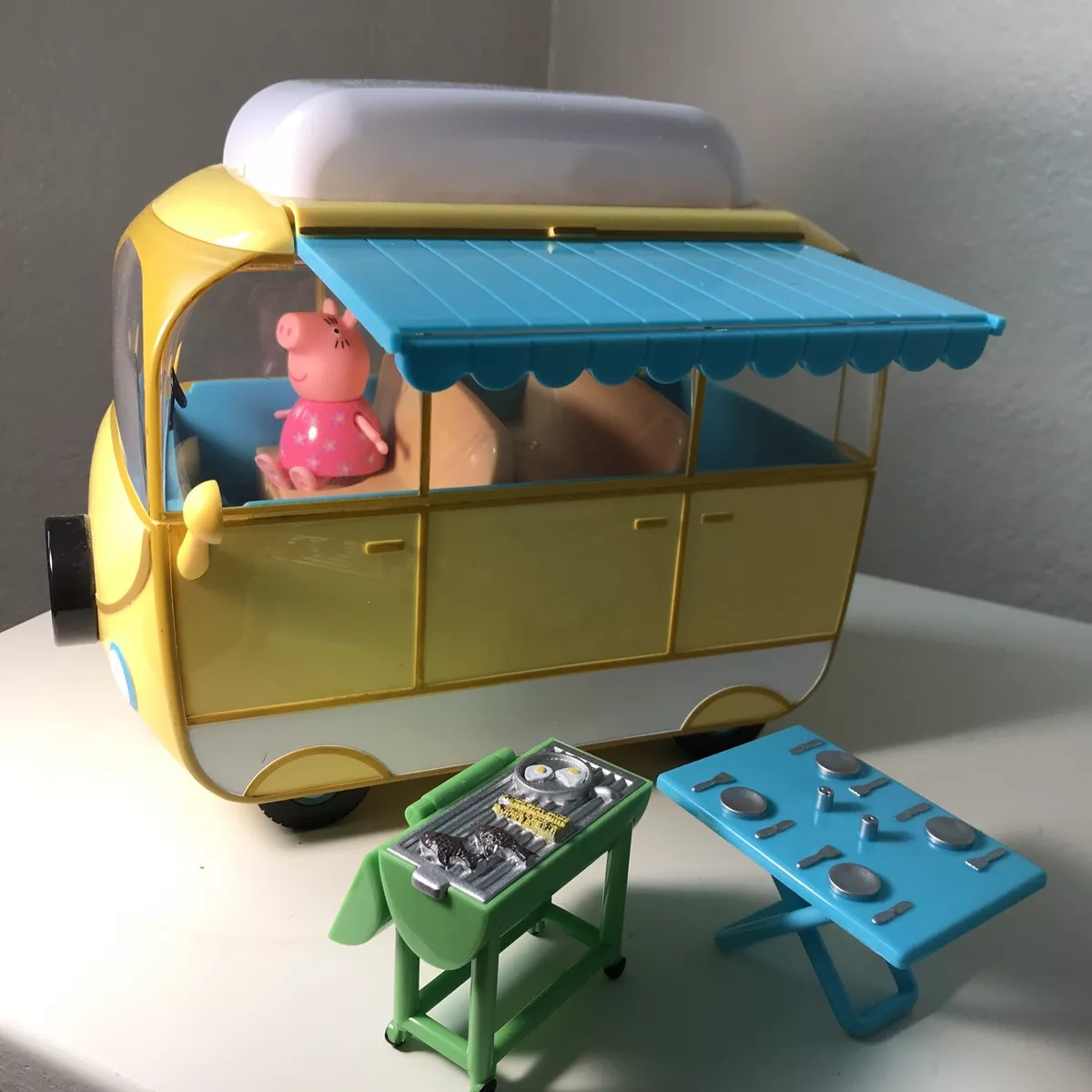 A plastic Peppa Pig toy play house standing on a table Stock Photo