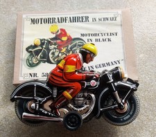MOTORCYCLIST IN BLACK TIN TOY made in Germany, VGC