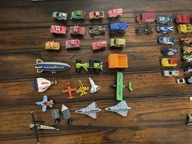 Vintage Micro Machines over 60 Mini Cars, Monster Trucks, Planes, and road.