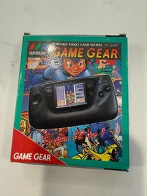 SEGA GAME GEAR BLACK HANDHELD SYSTEM WITH 12 GAMES CHARGER, COVER, TURNS ON