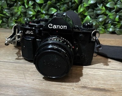 Canon A-1 35mm SLR Film Camera w/ 52mm Lens + 2 Lens Attachments & Strap