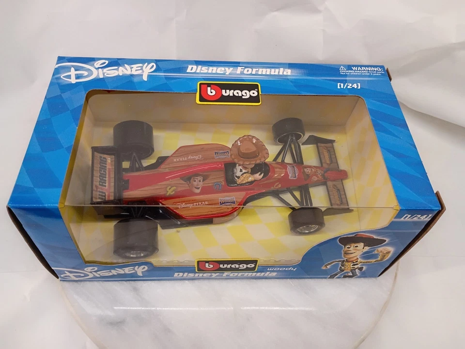Coche de Fórmula Disney fundido a presión Burago 1/24 Woody Toy Story de colección nuevo en caja Foto 3 de 4