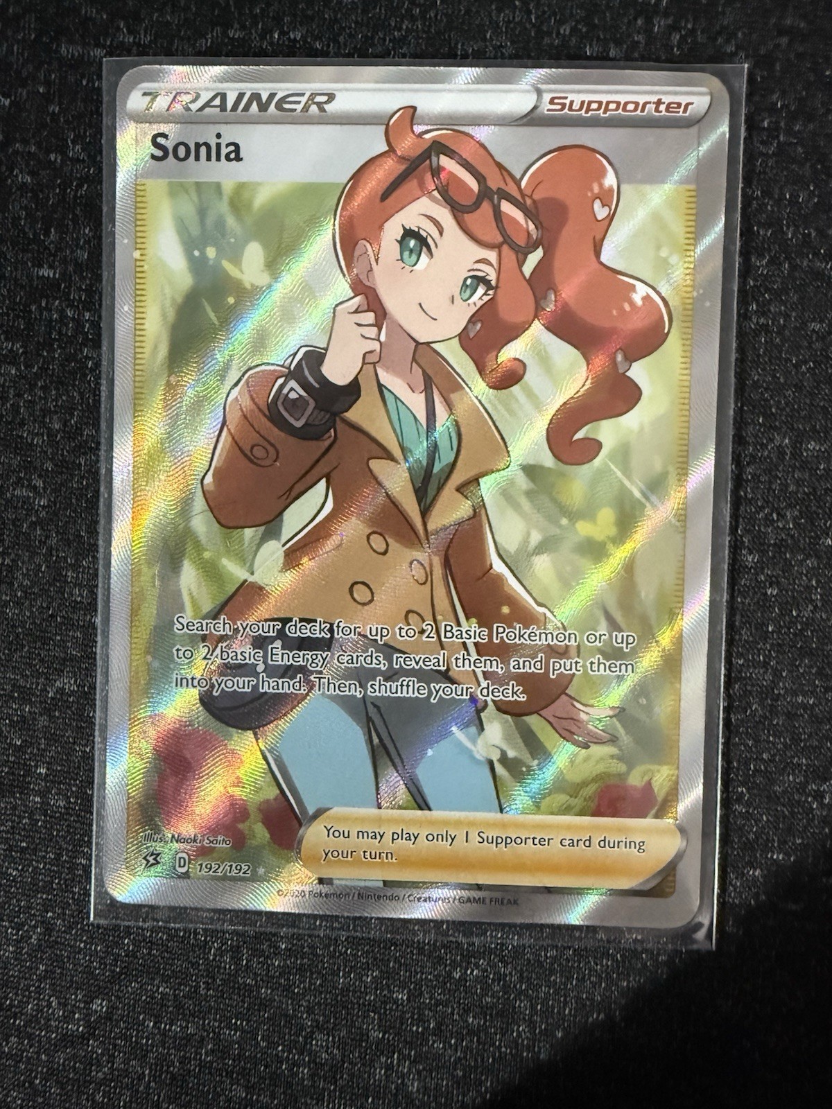 sonia pokemon card price Full Art - 192/192 - Rebel Clash proof acrylic case and featuring a striking image of the captivating character Sonia (Full Art) 192/192 Swsh02: