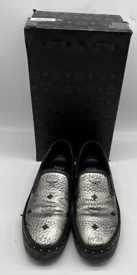 MCM Silver Metallic Leather Slip-On Sneaker w/ Black Logo Studded Trim sz  37