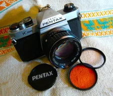 Pentax  K1000 camera w/  50mm lens. Serviced. Free Bk/Red lettering cap.READ!!