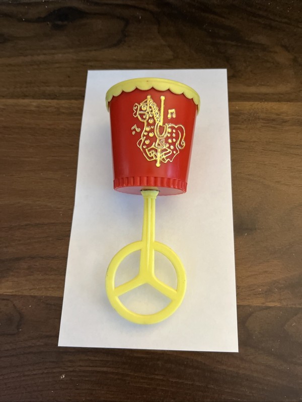 VINTAGE BABY PLASTIC RATTLE WITH EMBOSSED CAROUSEL HORSE MADE IN HONG KONG