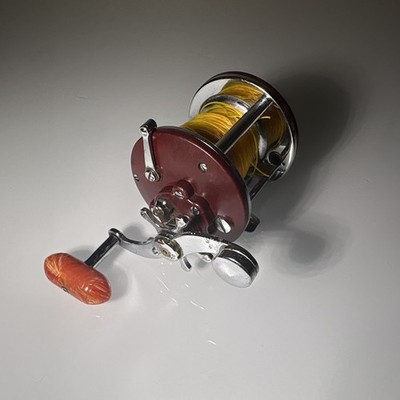Vintage Maroon Penn Peerless No. 9 Conventional Reel with orange handle