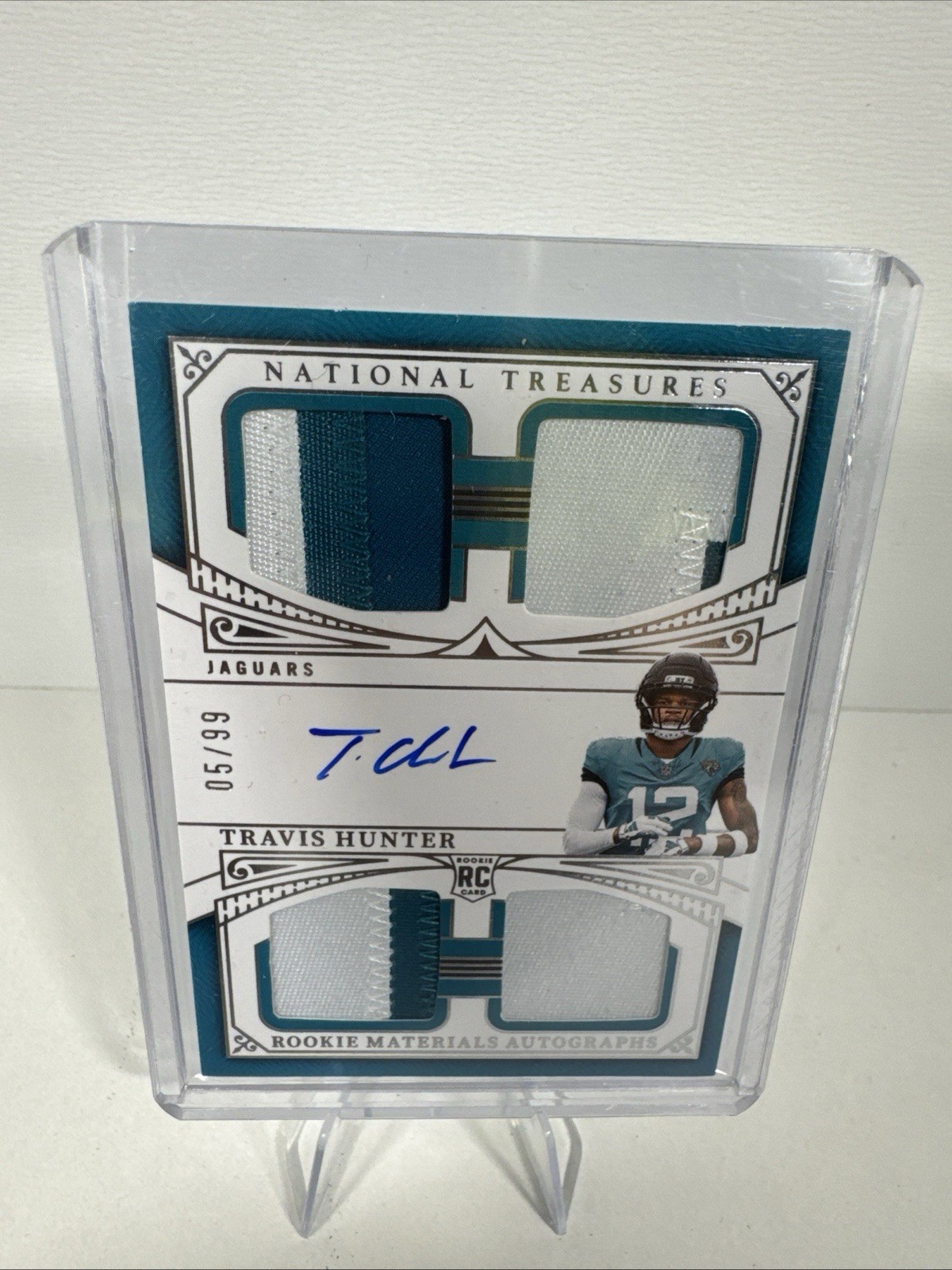 2025 Panini National Treasures - Quad Travis Hunter #RMAQ-THR /99 (AU, MEM, RC)