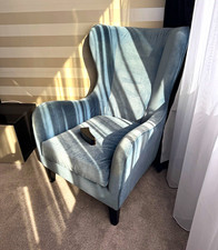 Powder blue velvet Wingback Accent Chair arms, requires 2 nuts to secure legs.