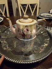 Burton & Burton Teapot characterized by its pale yellow to pink gradient...