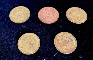 Three Chucke CheeseTokens and two Discovery Zone Tokens