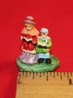 Christmas Village Lot of 10 Figures - 12 People, Santa, Tree, Dog & Snowman — photo 5