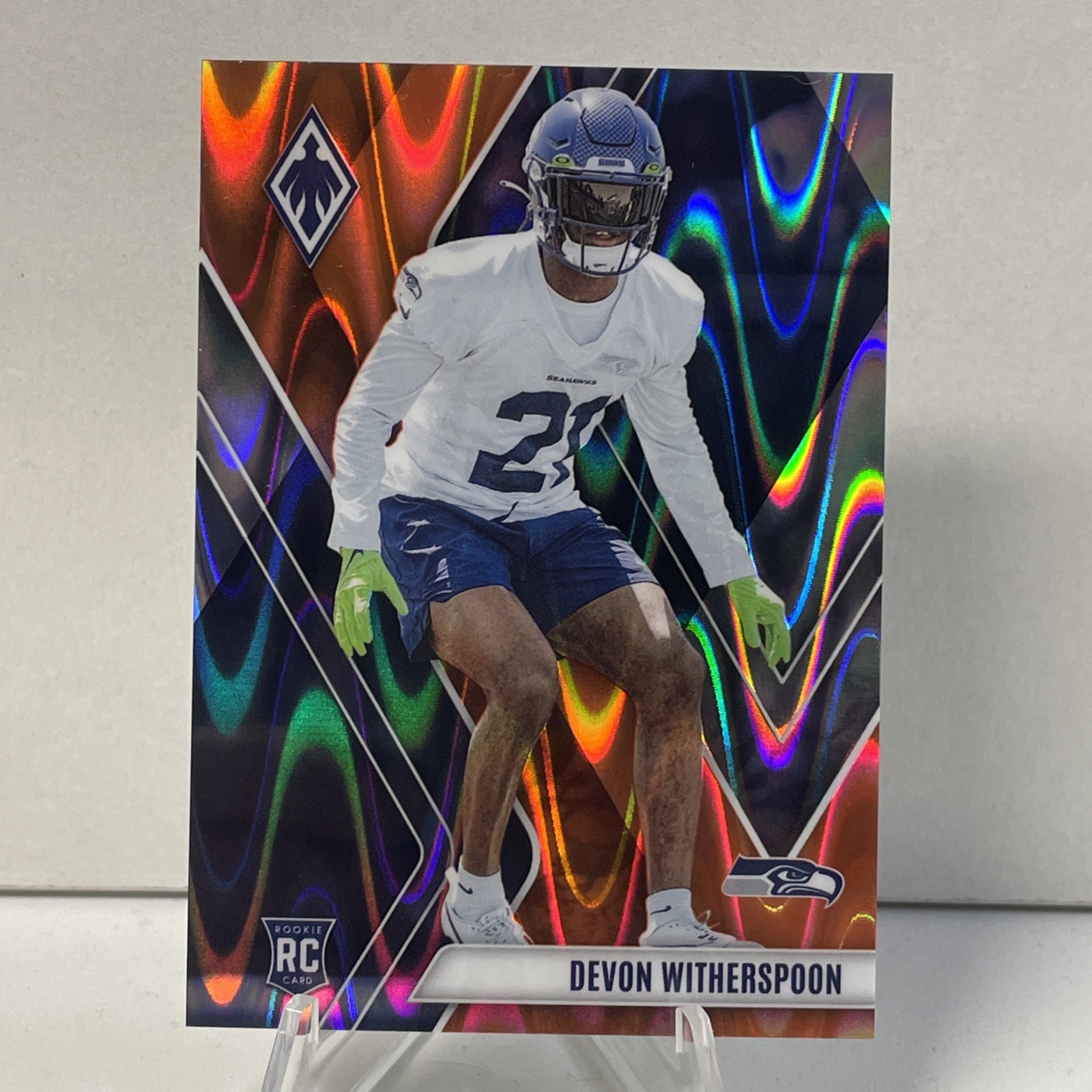 2023 Panini Phoenix - Rookies Devon Witherspoon #145 Orange Seismic /99 (RC)