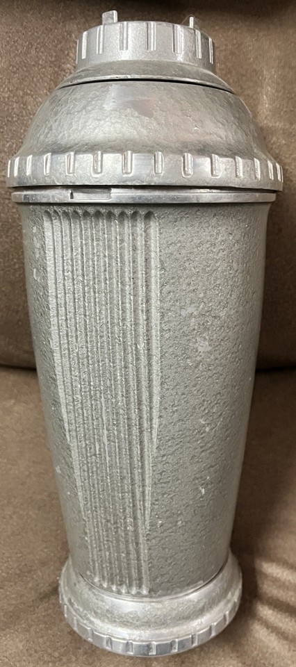 A museum-quality MCM metal cocktail shaker with original paperwork intact — the 'Precision Cooler' name alone earns it a spot on any serious bar cart.
