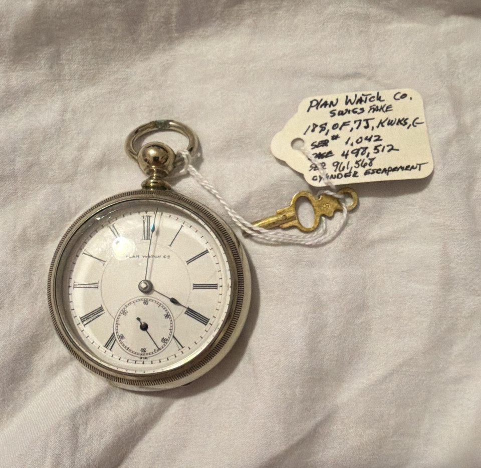 An 1800s Plan Watch Co. open-face pocket watch with a crisp white Roman numeral dial — a genuine 19th-century manual-wind timepiece, the kind of thing you pass down.