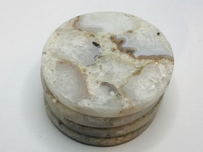 A set of four vintage natural marble round coasters
