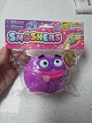 Neu in Verpackung Orb Curiosities Smushers lila Gesicht mit Brille viral matschig