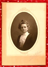 Attractive Young Victorian Woman with Light Hair Done Up and High Collar