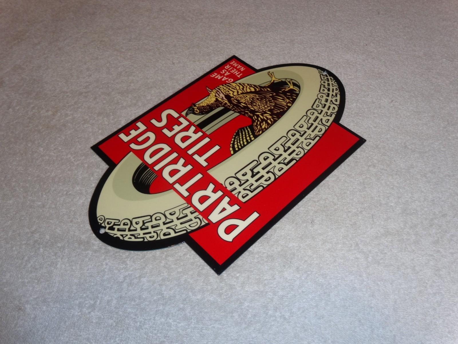 VINTAGE "PARTRIDGE TIRES" W/ HEN / ROOSTER 12" METAL TIRE GAME GASOLINE OIL SIGN