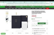 Navy blue combined vanity unit with basin and toilet, brushed brass handles.