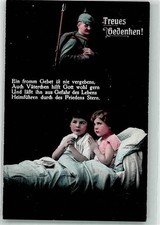 39871772 - Two children say a goodnight prayer for the father in the field WW I