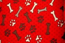 BTY HOLIDAY DOG/CAT PAW PRINTS BONES/POLKA DOTS ON RED FLEECE FABRIC 1 YD 60X36"