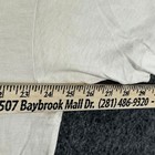 Cream Fruit of the Loom men’s XXL T-shirt with yellow bridge design, white text, and Baybrook Mall address.