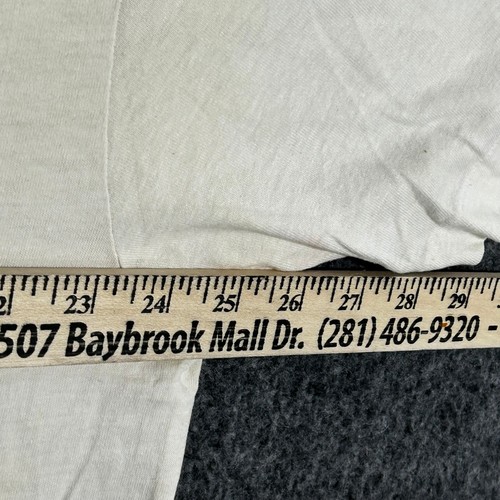 Cream Fruit of the Loom men’s XXL T-shirt with yellow bridge design, white text, and Baybrook Mall address.