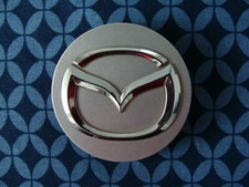 Mazda Center Cap Single OEM P/N:  2477 Used in Good Condition