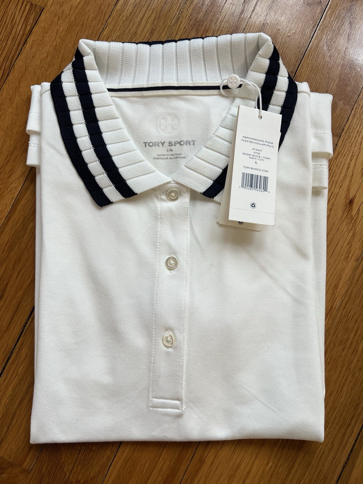 TORY BURCH PERFORMANCE PIQUE PLEATED-COLLAR POLO IN SNOW WHITE SIZE: L