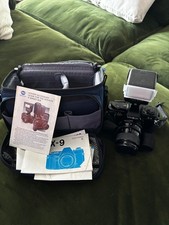 Minolta X-9 55mm manual focus SLR film camera with zoom lens. Includes Case.