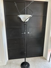stylish floor lamp twisted metal frame and a frosted glass shade Italian Design