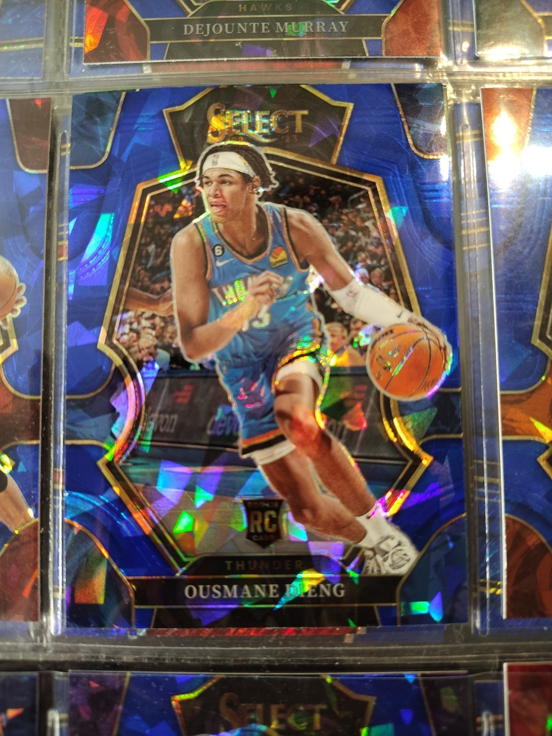 2022-23 Panini Select Ousmane Dieng Premier Level Blue Cracked Ice Prizm #190