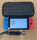 Nintendo Switch Console with Neon Blue/Neon Red Joy-Con Controllers + Game