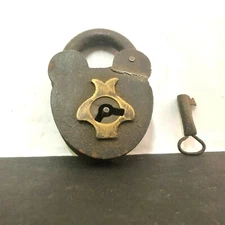 AN OLD VINTAGE IRON BRASS FISH SHAPE PEG PADLOCK WITH KEY .