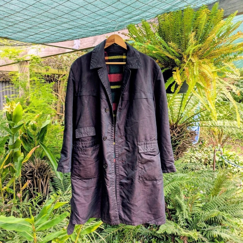 Black vintage trench coat with plaid lining and a purple sheen