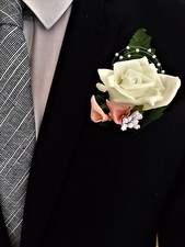 Wedding buttonhole corsage for groom/guests. calla lily, rose babies breath