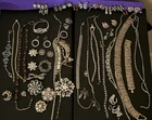 Large lot vintage rhinestone costume jewelry. Clip-on earrings, brooches & more!