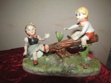 STATUINA IN PORCELLANA CAPODIMONTE BAMBINI IN ALTALENA ANNI 50 SERIE P