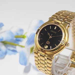 Montre homme Gucci date dorée F433 du Japon