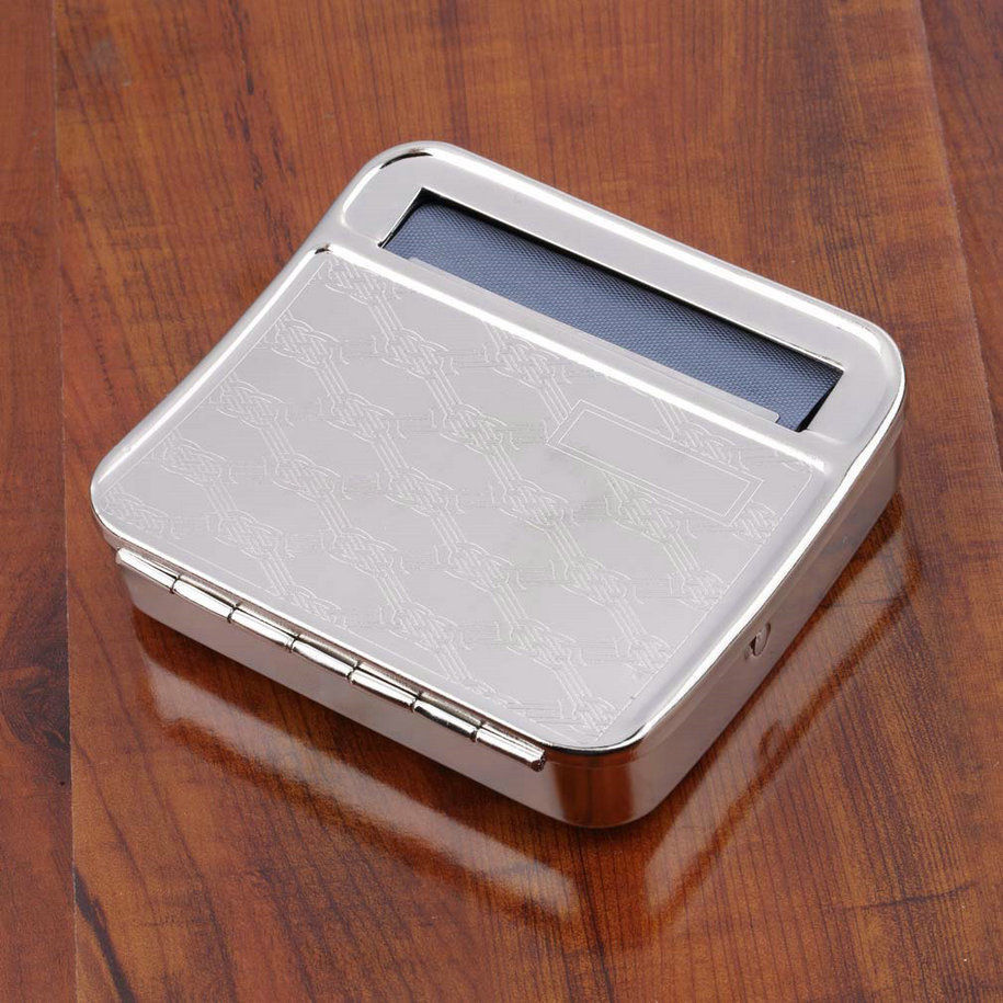 one NULITE METAL TOBACCO ROLLING MACHINE W/Sticker-Box case Random design