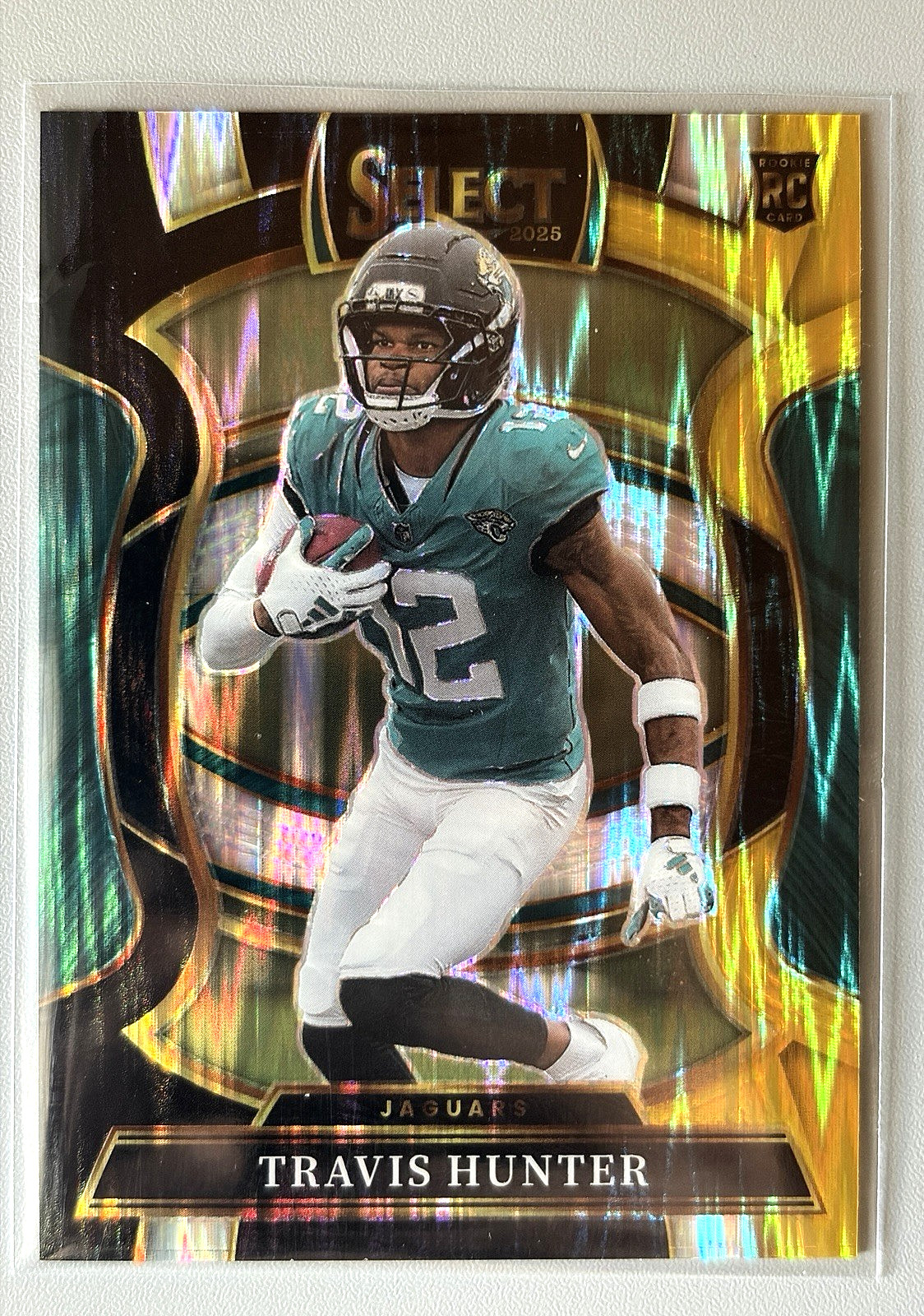 2025 Panini Select Concourse Travis Hunter #28 Black & Gold Prizm Shock (RC)