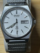 Seiko SQ 100 Watch Men 34mm White Dial Silver Tone Daydate 6923-8019 NewBat