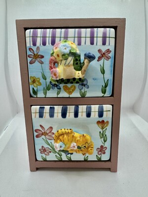 Mini Tabletop Wooden Cabinet with ceramic drawers. cat and watering can
