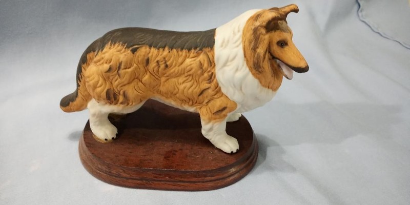 Collie Figurine on wood pedestal