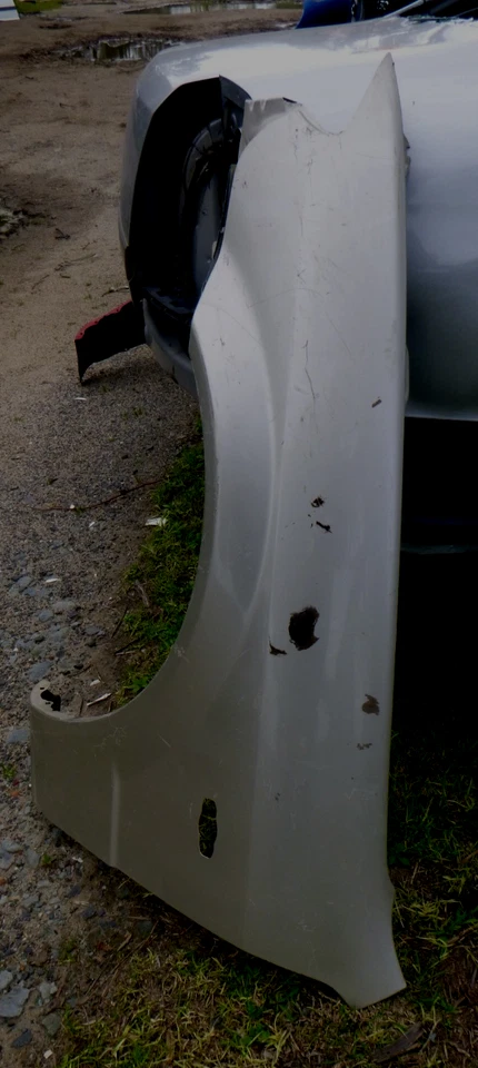 Mazda 323 BJ 3/01-03 Left Guard - image 2 of 3