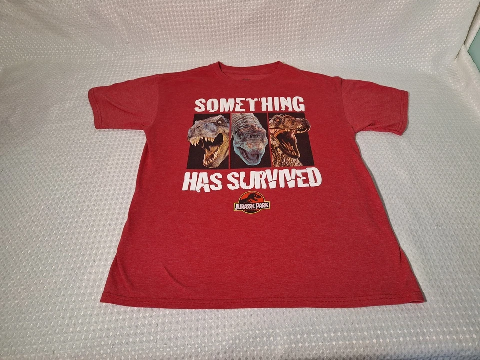 Camiseta Jurassic Park Something Has Survived roja mezcla de algodón niños talla 2XL 18 Foto 3 de 4