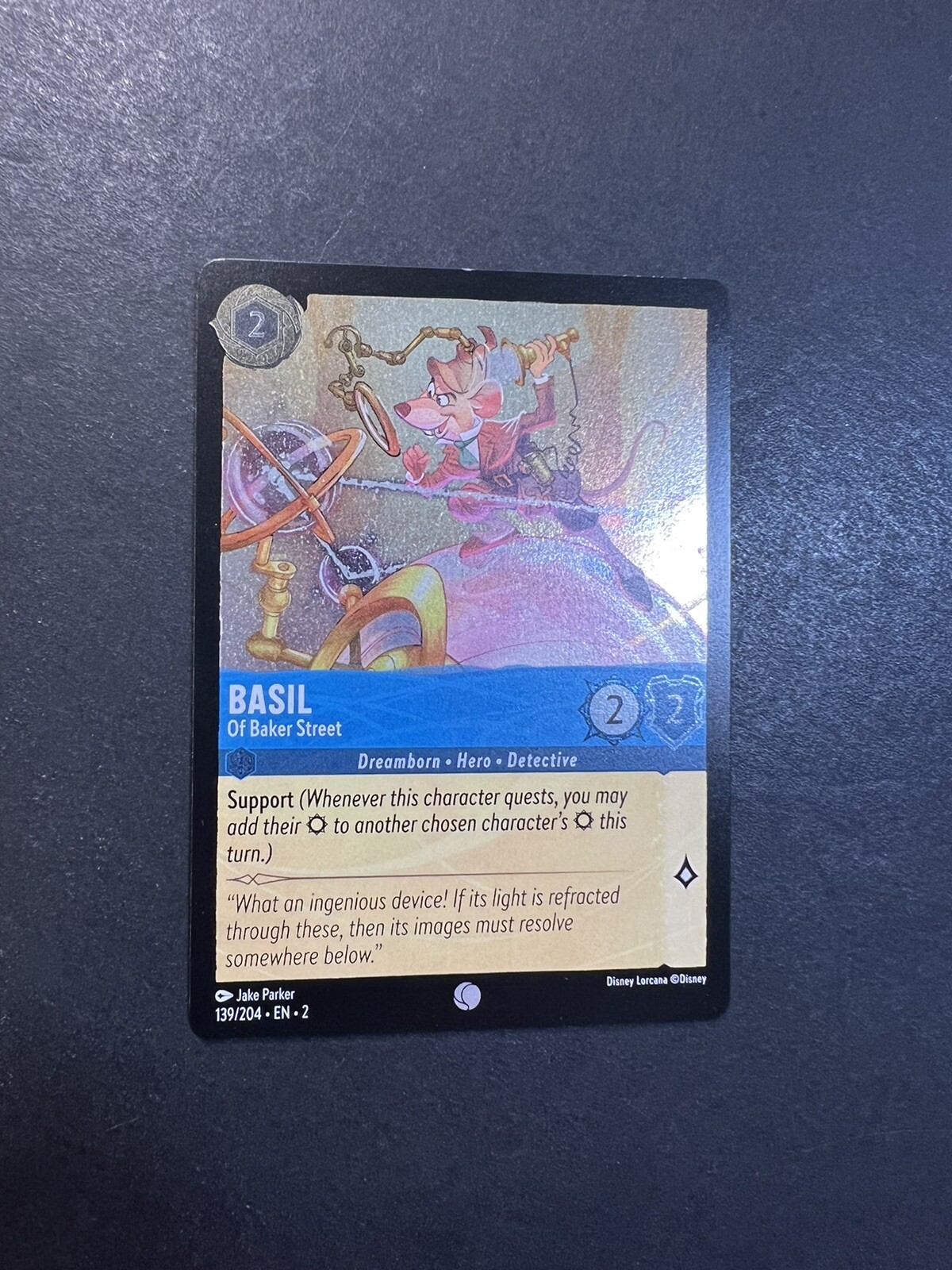 FOIL Disney Lorcana Floodborn: Basil - Of Baker Street - 139/204 Holo - MINT