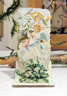 Angels bringing Tree. Fold down Raphael Tuck created Christmas Card. Early 1900s